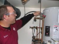 An Oxnard Water Heater Repair Team Member Installs New Water Heaters